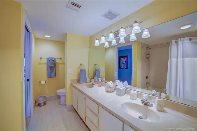 a kitchen with stainless steel appliances granite countertop a stove top oven a sink a counter space and cabinets