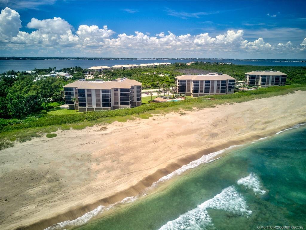 2491 Northeast Ocean Boulevard, Unit 103 Stuart, FL 34996 - Photo 30 of 38 a view of a house with a big yard