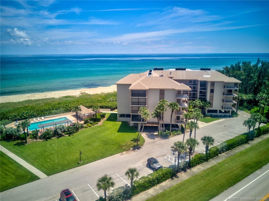 2491 Northeast Ocean Boulevard, Unit 103 Stuart, FL 34996 - Photo 32 of 38 a view of a patio with furniture and garden