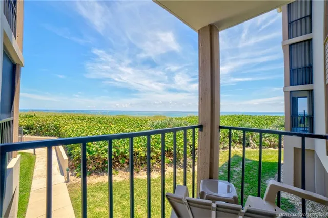 a view of balcony with yard