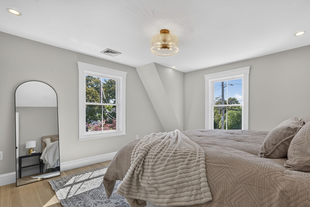 20 Saltonstall Road Medford, MA 02155 - Photo 24 of 41 a bedroom with a large bed and a window