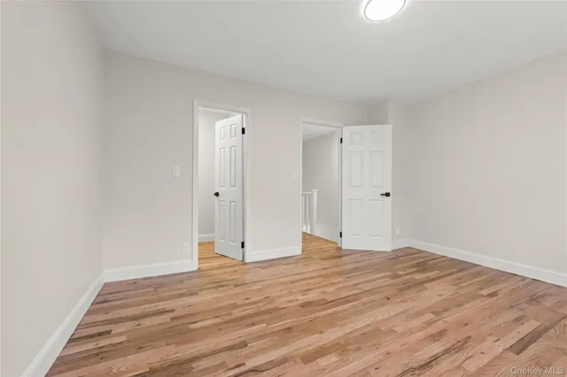 a view of room with wooden floor