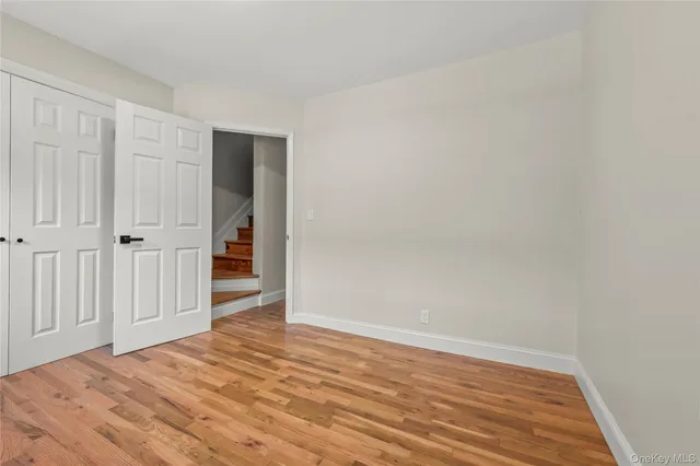 a view of a livingroom with wooden floor and closet
