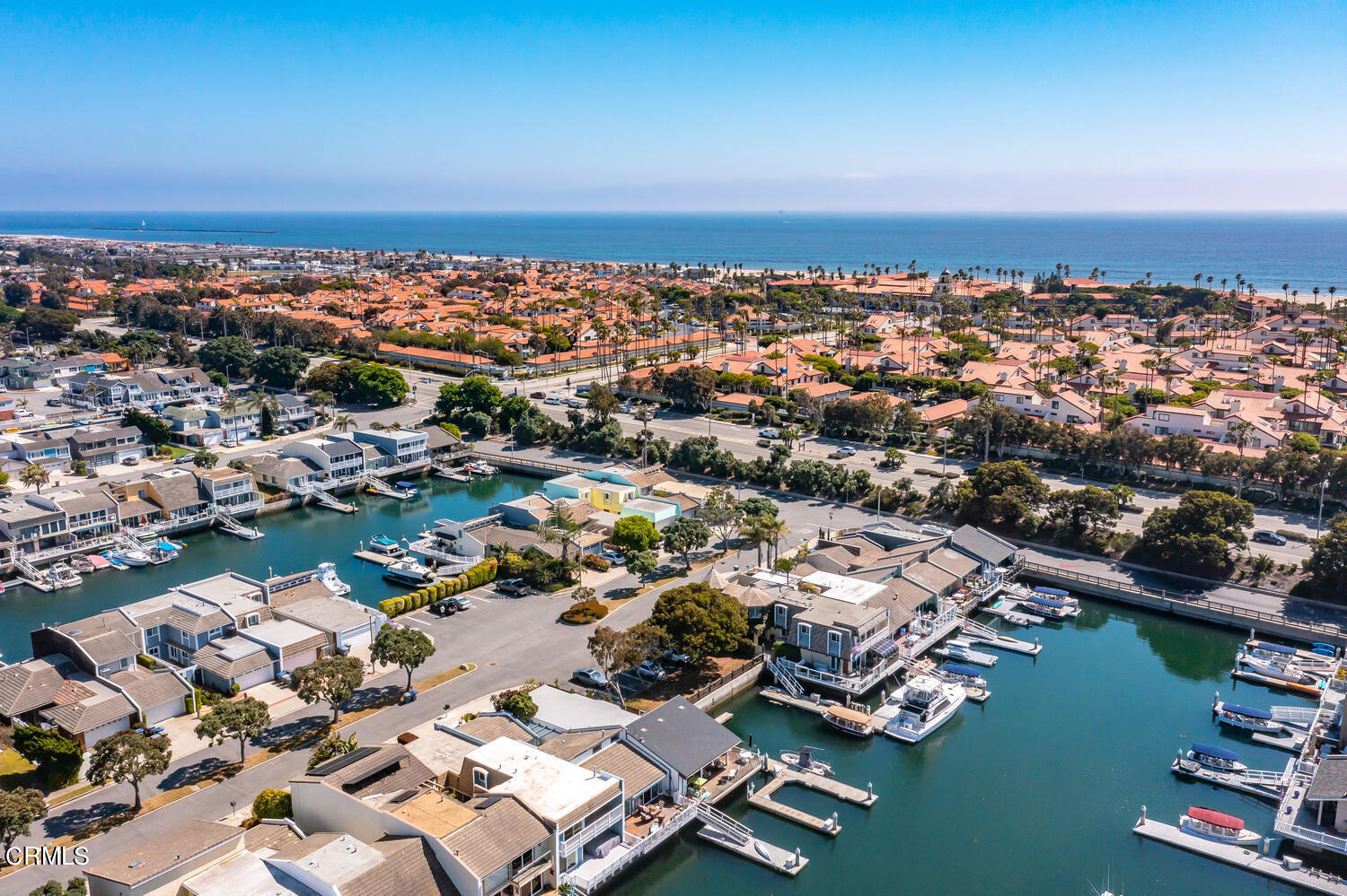 an aerial view of a city with ocean view