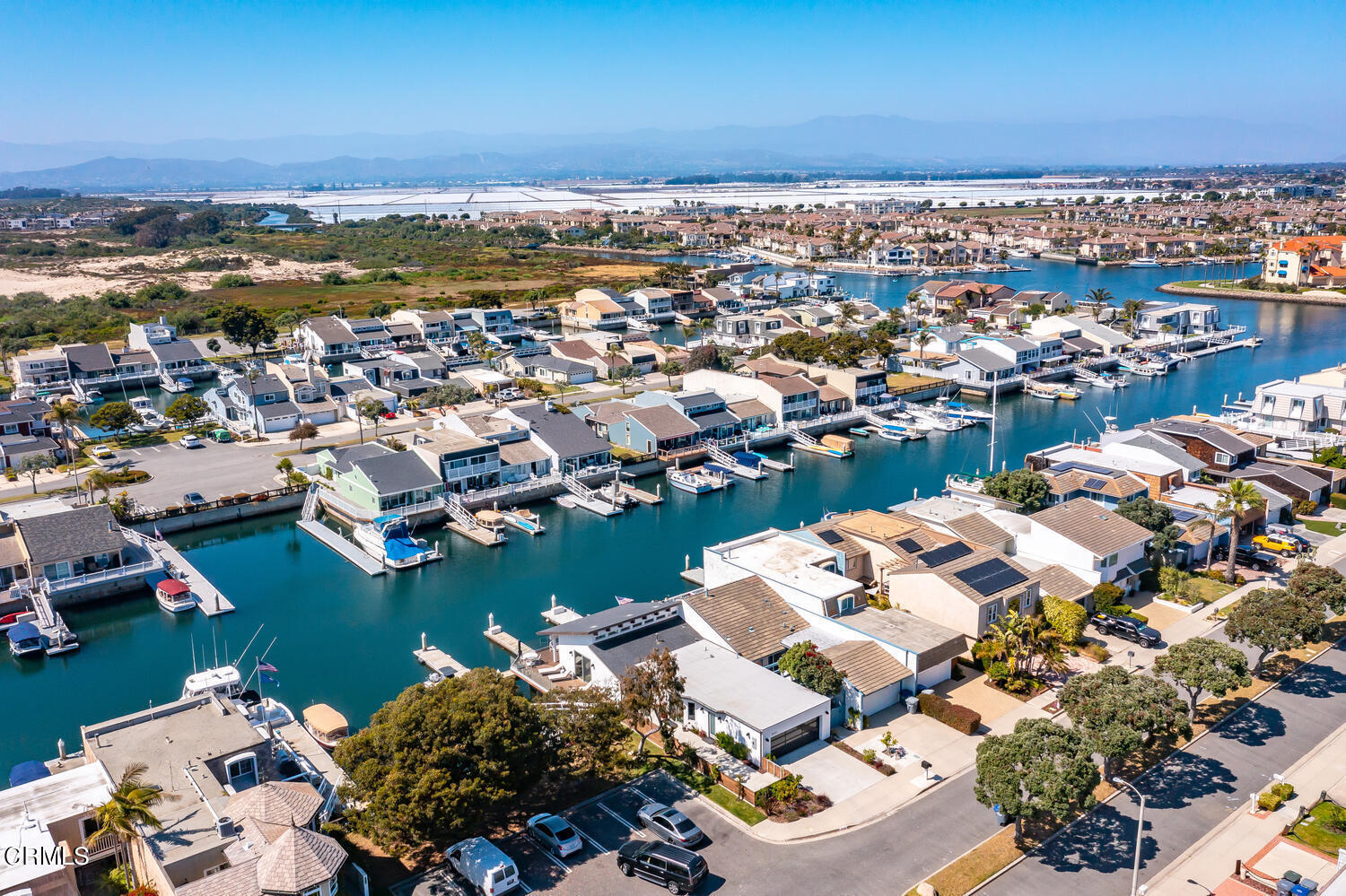 4555 Gateshead Bay Oxnard, CA 93035 - Photo 2 of 34 an aerial view of a city with ocean view