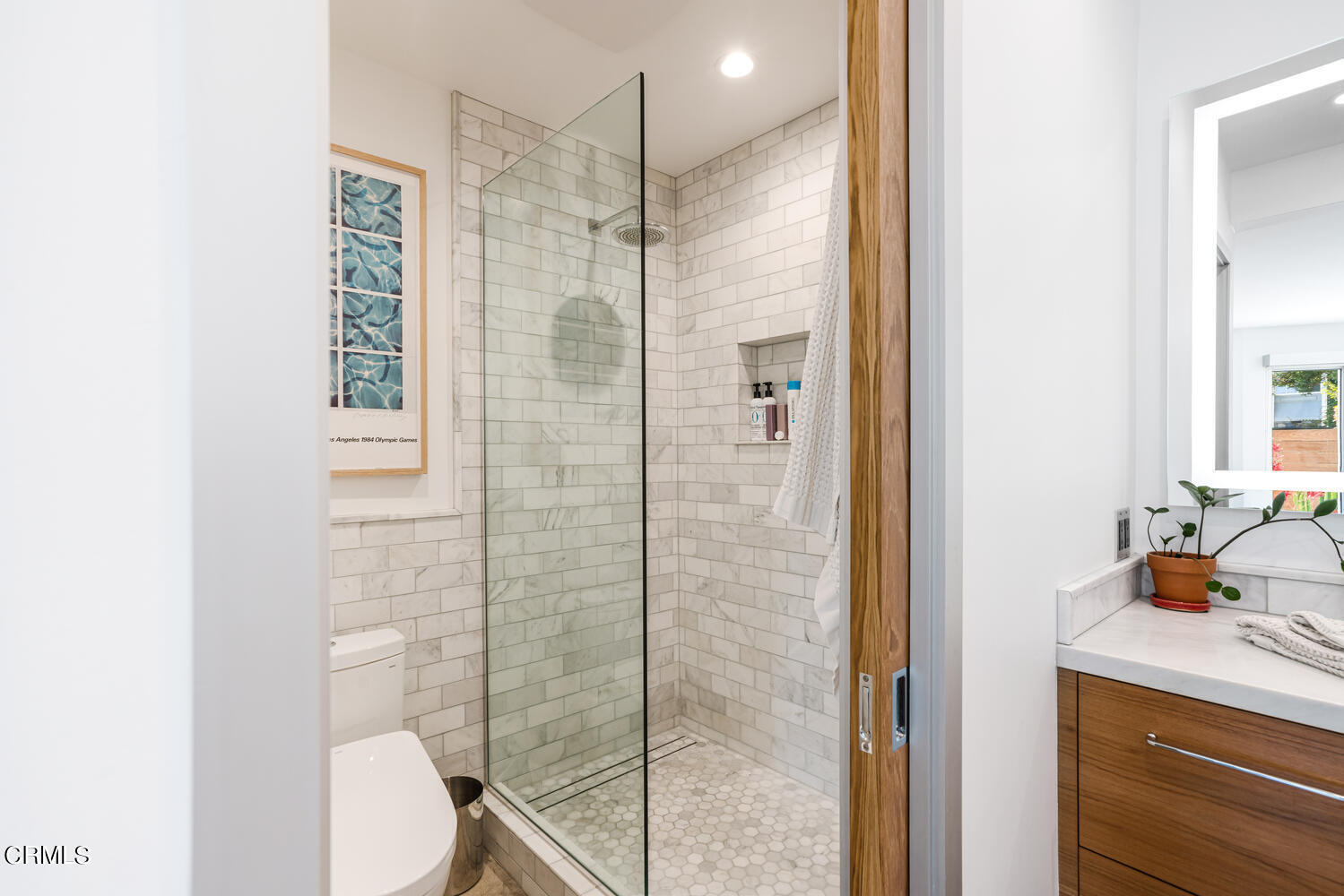 4555 Gateshead Bay Oxnard, CA 93035 - Photo 22 of 34 a bathroom with a shower toilet and sink