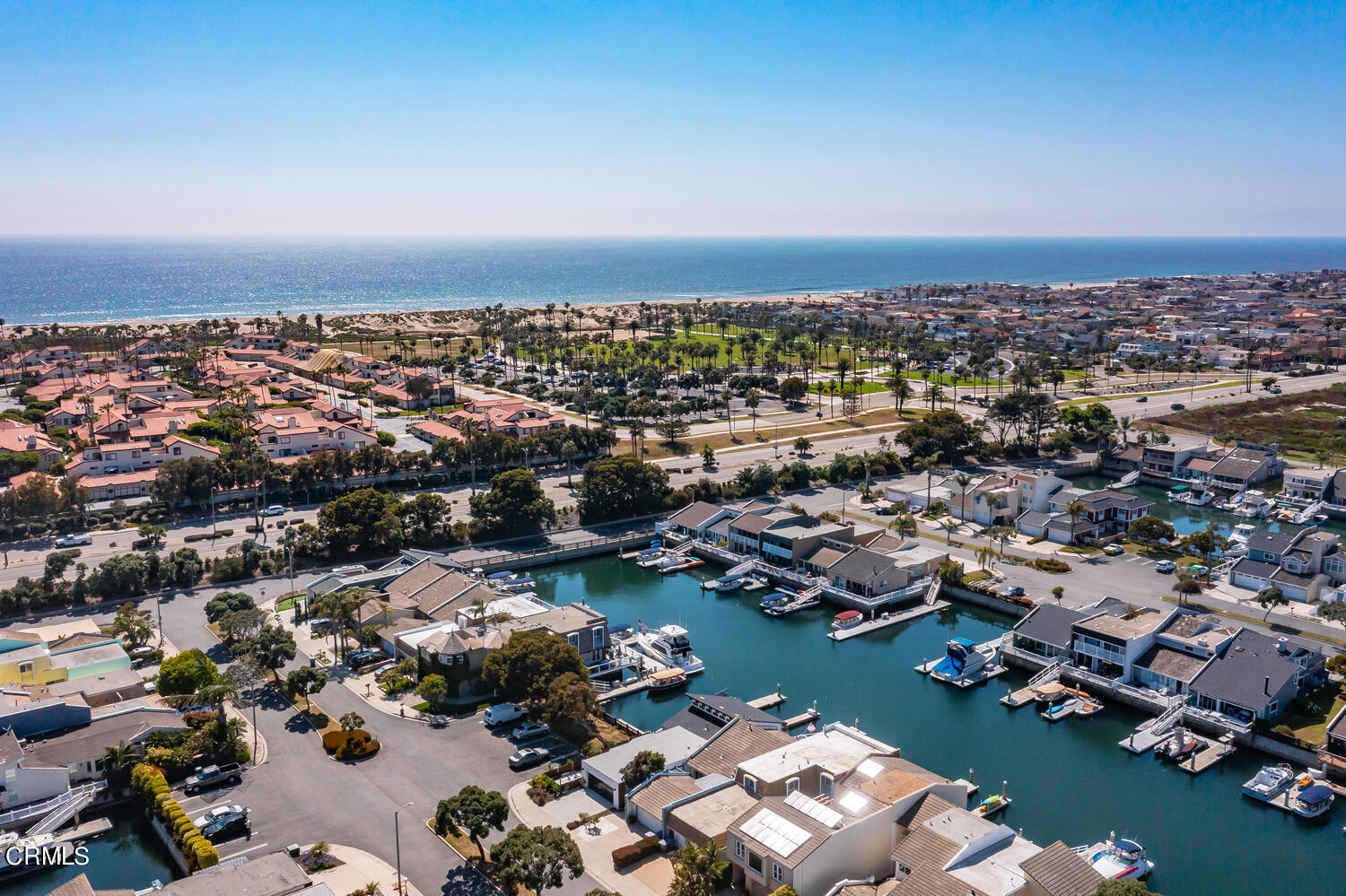4555 Gateshead Bay Oxnard, CA 93035 - Photo 5 of 34 an aerial view of a city with lots of residential buildings