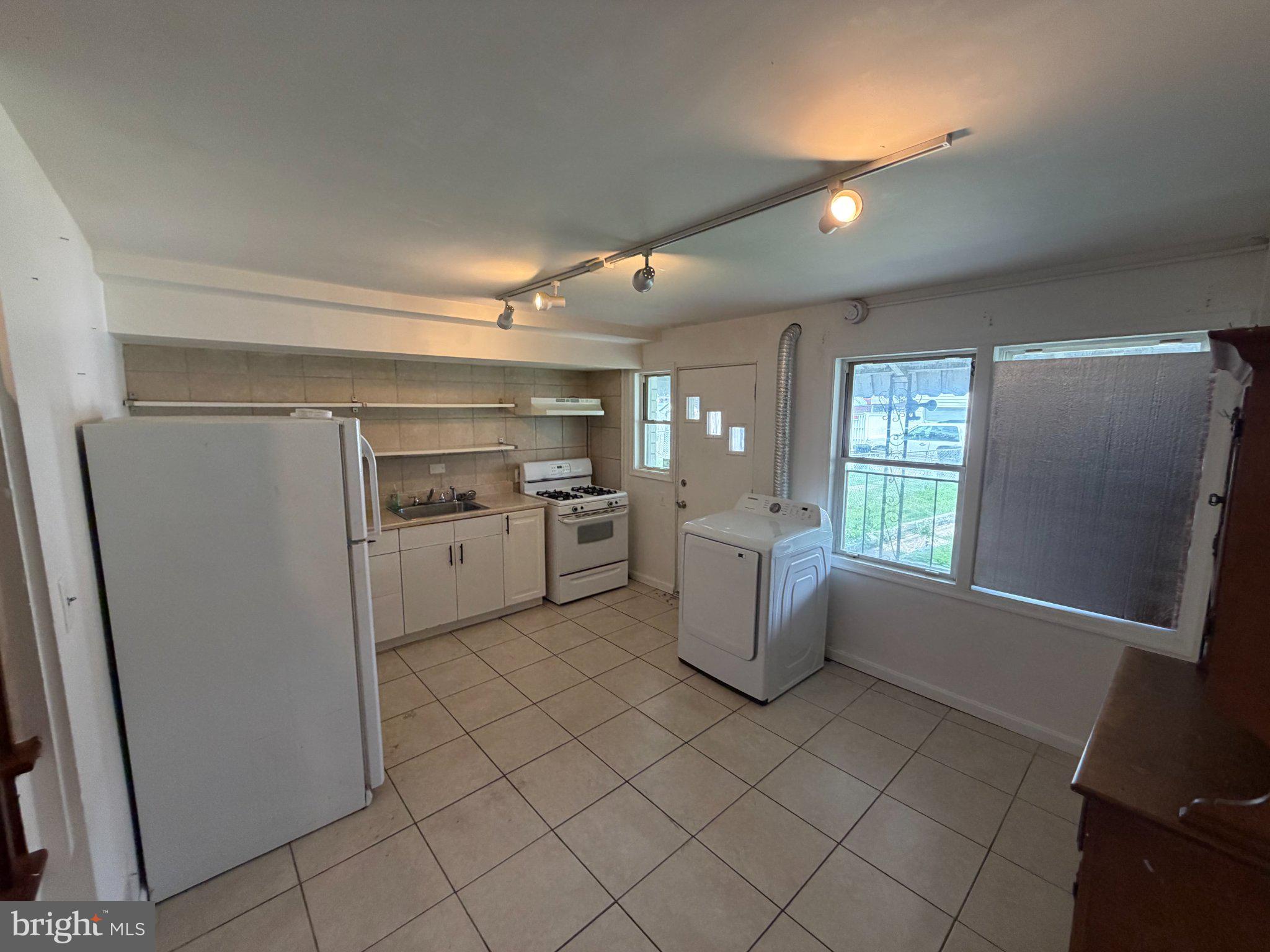 7216 Conley Street Baltimore, MD 21224 - Photo 14 of 14 Bright and airy kitchen space.