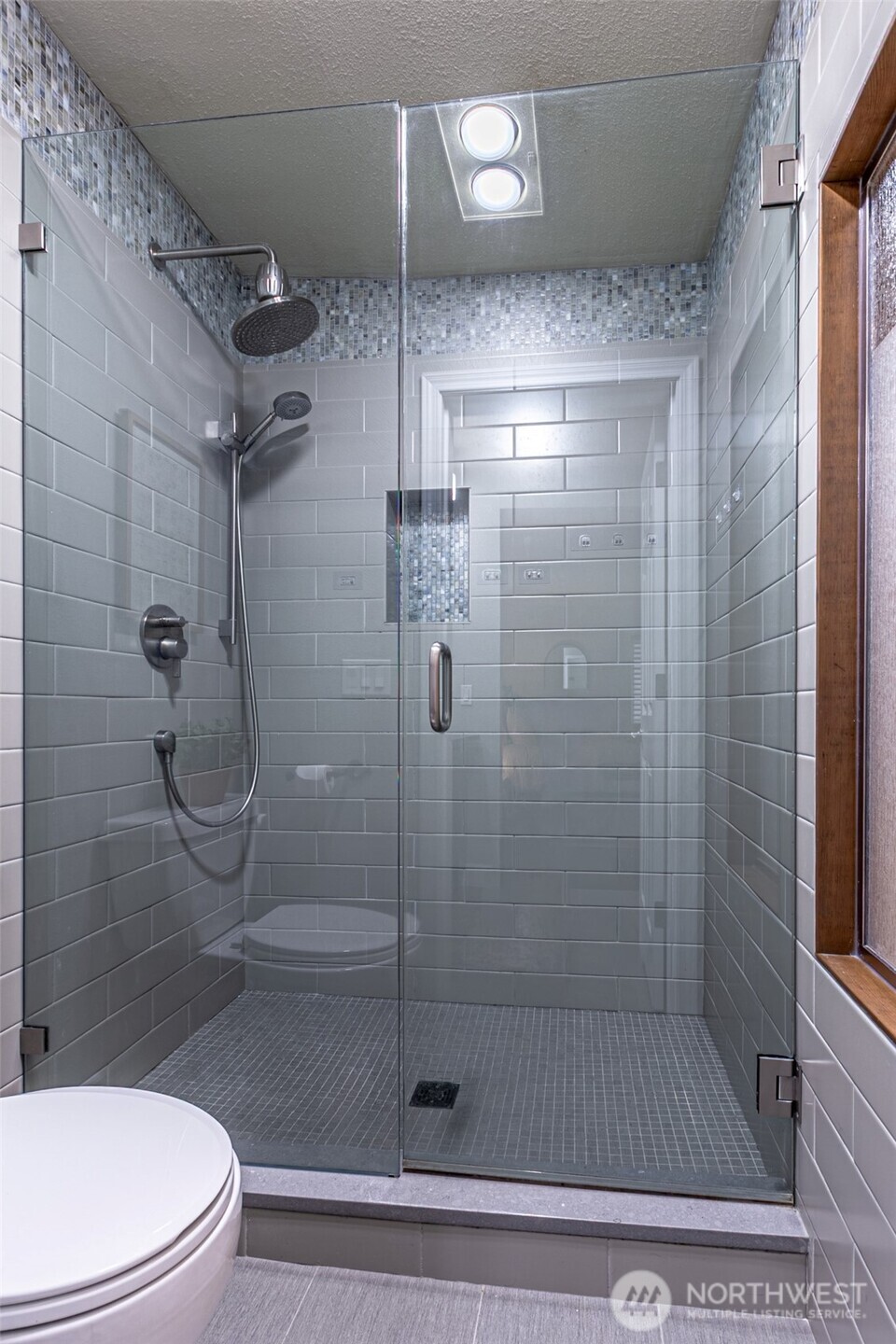 525 Broadway, Unit 408 Tacoma, WA 98402 - Photo 24 of 35 a bathroom with a shower and toilet