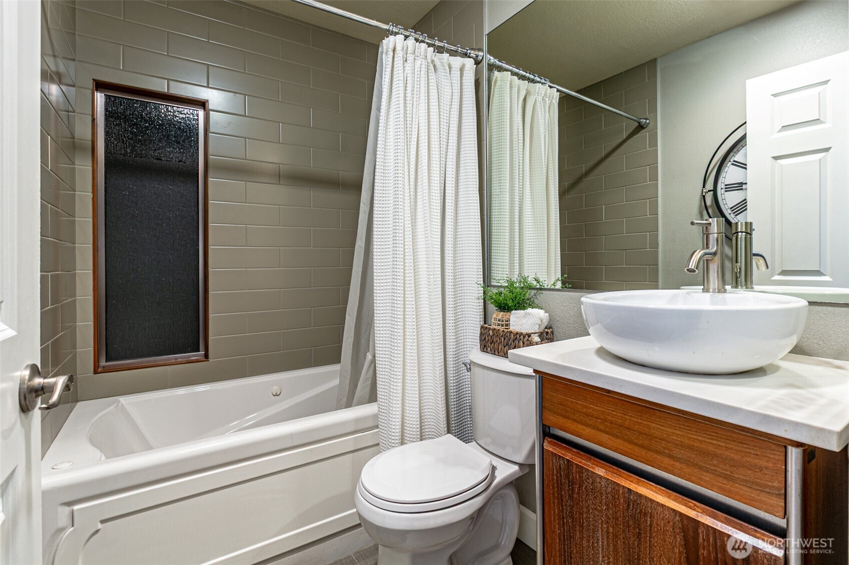 525 Broadway, Unit 408 Tacoma, WA 98402 - Photo 27 of 35 a bathroom with a sink a toilet and shower