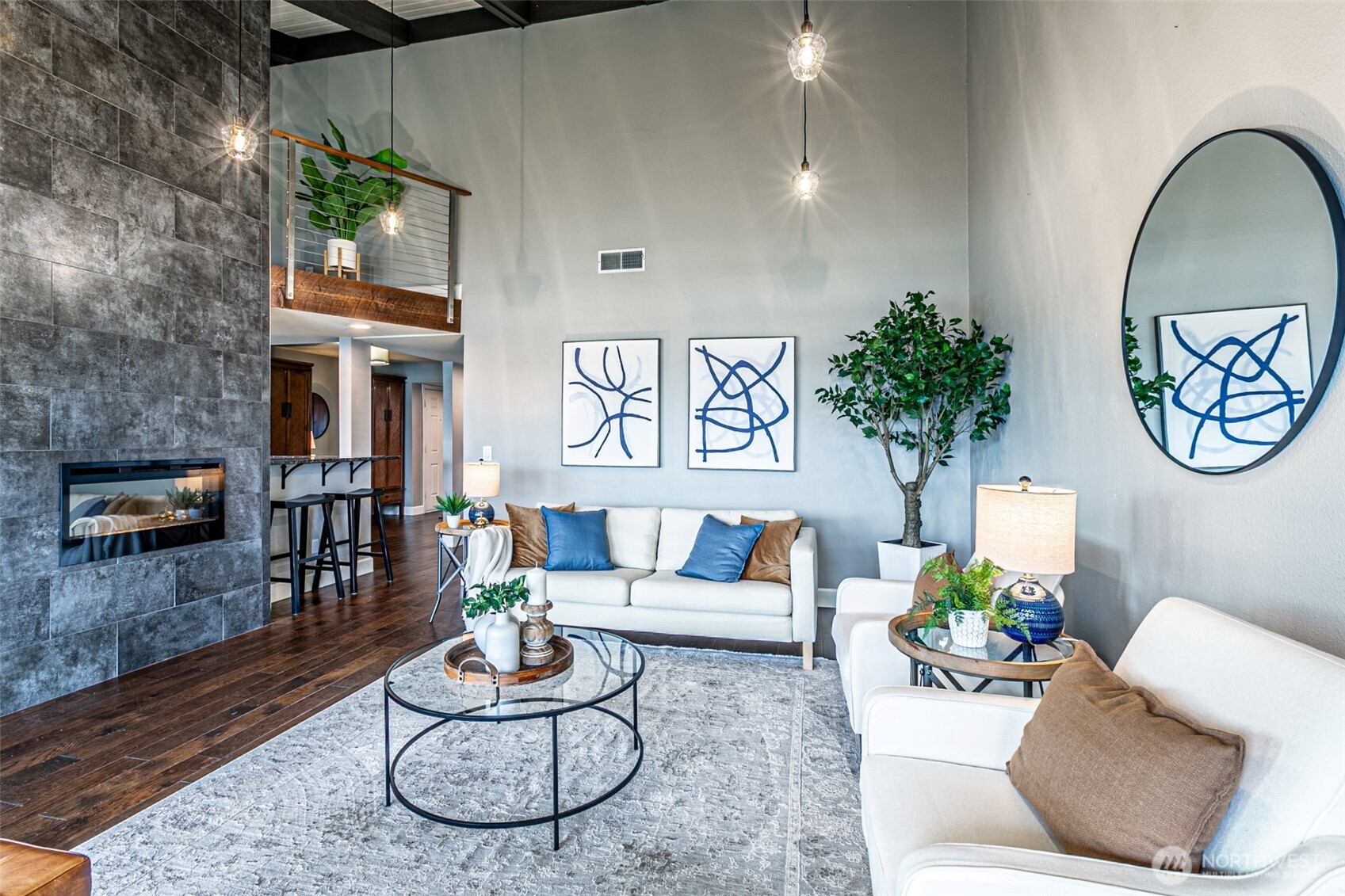 525 Broadway, Unit 408 Tacoma, WA 98402 - Photo 5 of 35 a living room with furniture and a flat screen tv