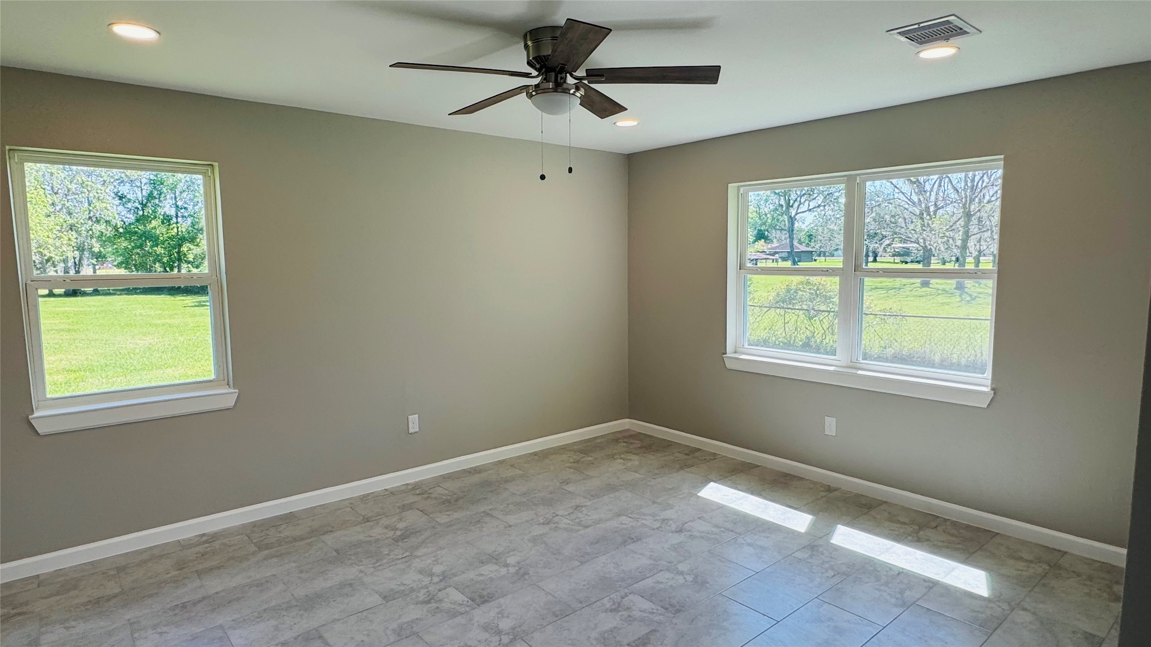 1434 County Road 878A Sweeny, TX 77480 - Photo 28 of 36 a view of a livingroom with a ceiling fan and window