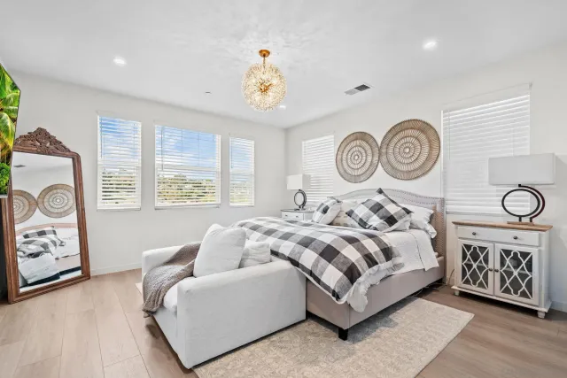 a bedroom with bed and a window