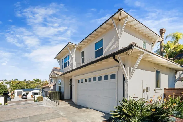 a view of a house with a street