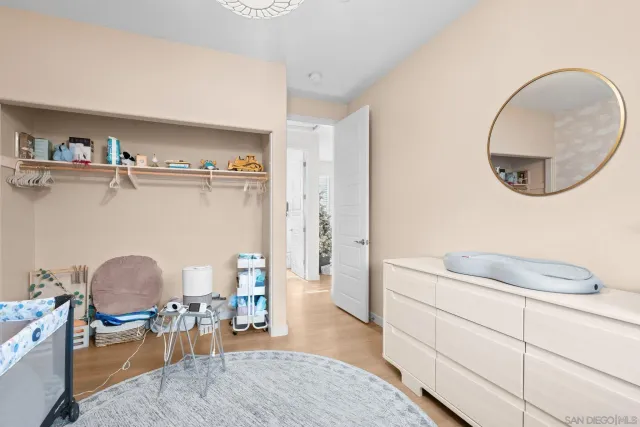 a living room with furniture and a chair