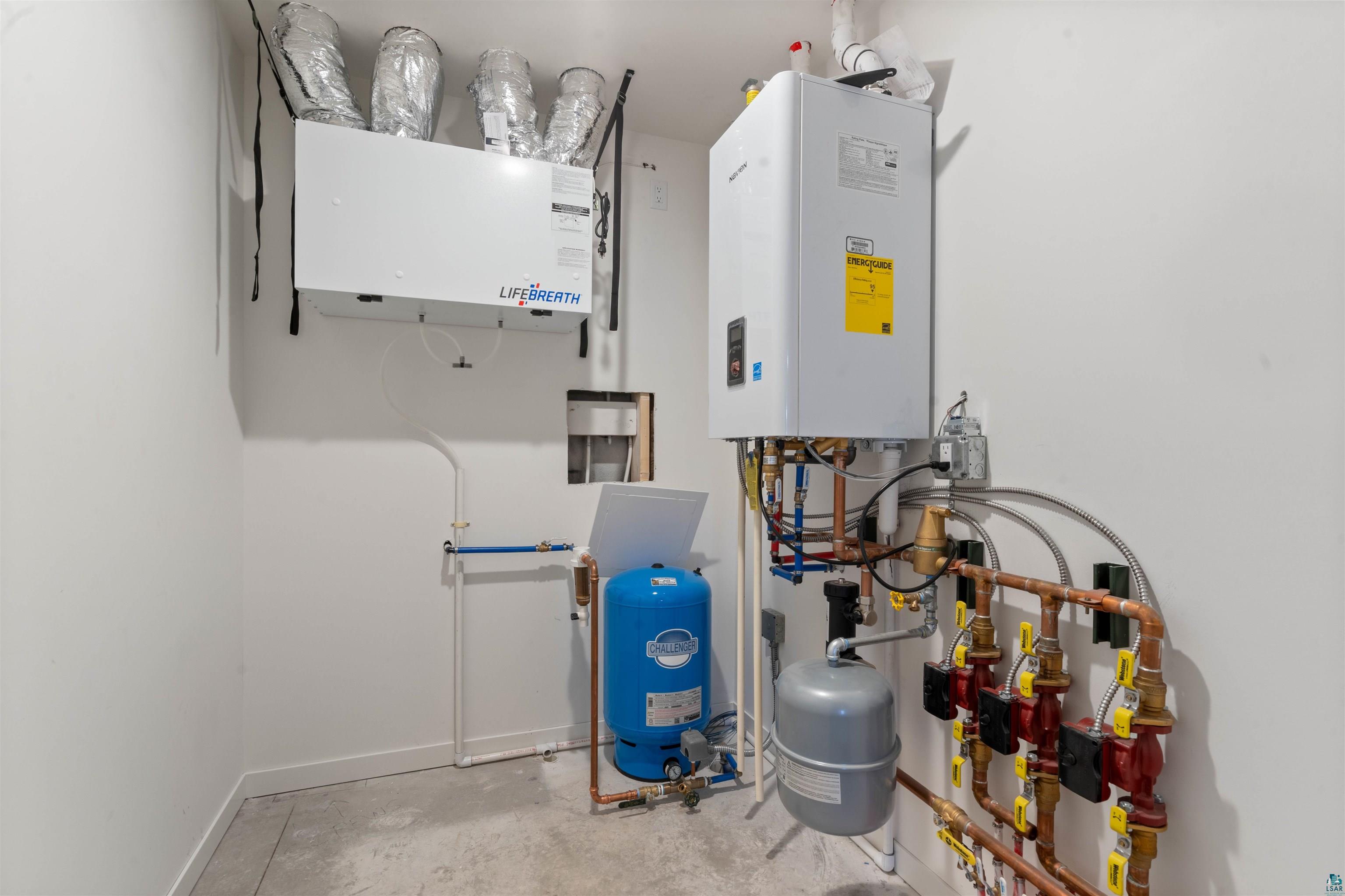 1386 Stephen Road Cloquet, MN 55720 - Photo 25 of 25 Dedicated utility room featuring a tankless water heater, comprehensive plumbing manifold, and ventilation system