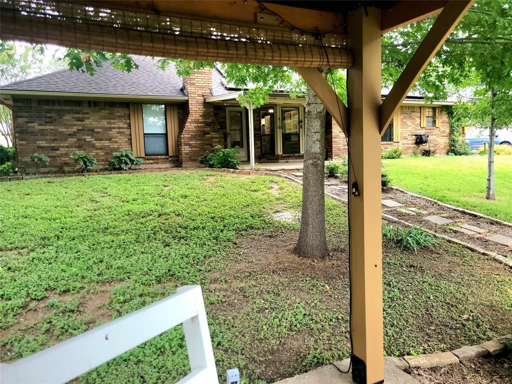 912 North Dove Road Grapevine, TX 76051 - Photo 27 of 36 a front view of a house with garden