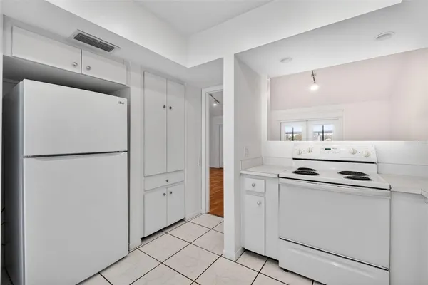 a kitchen with stainless steel appliances granite countertop a sink and cabinets