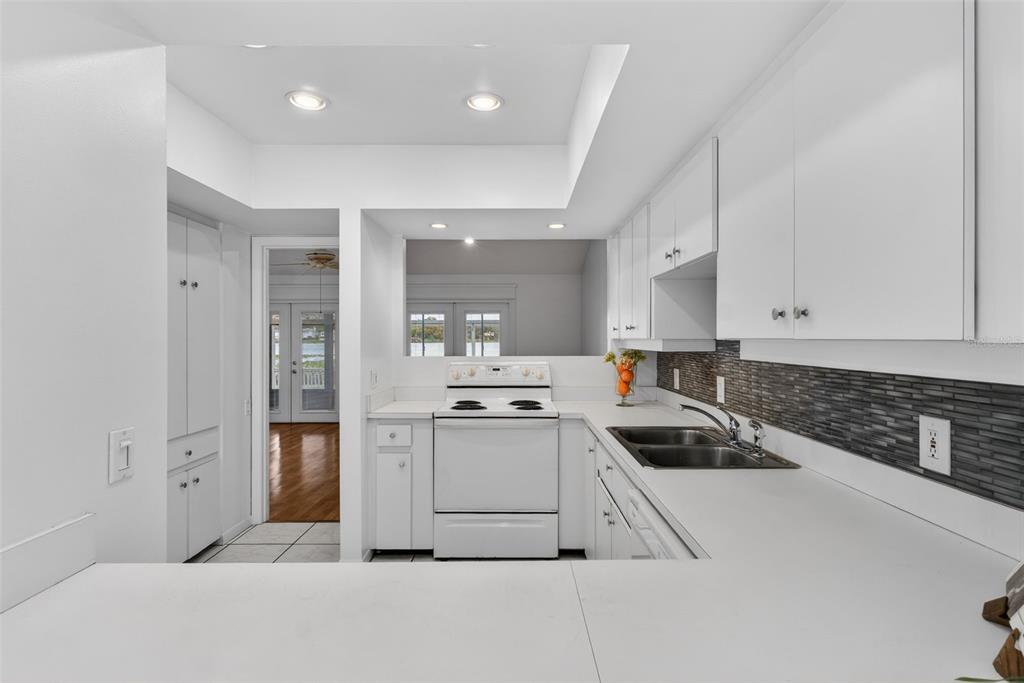 1502 Buckeye Road Northeast, Unit 4 Winter Haven, FL 33881 - Photo 13 of 49 a kitchen with stainless steel appliances granite countertop a sink and cabinets