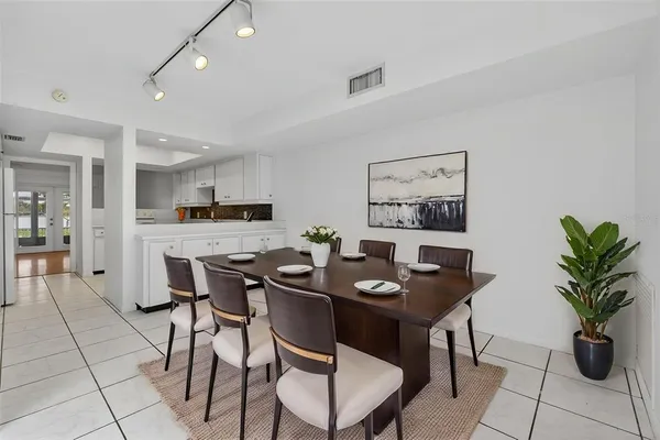 a kitchen with cabinets oven and a sink