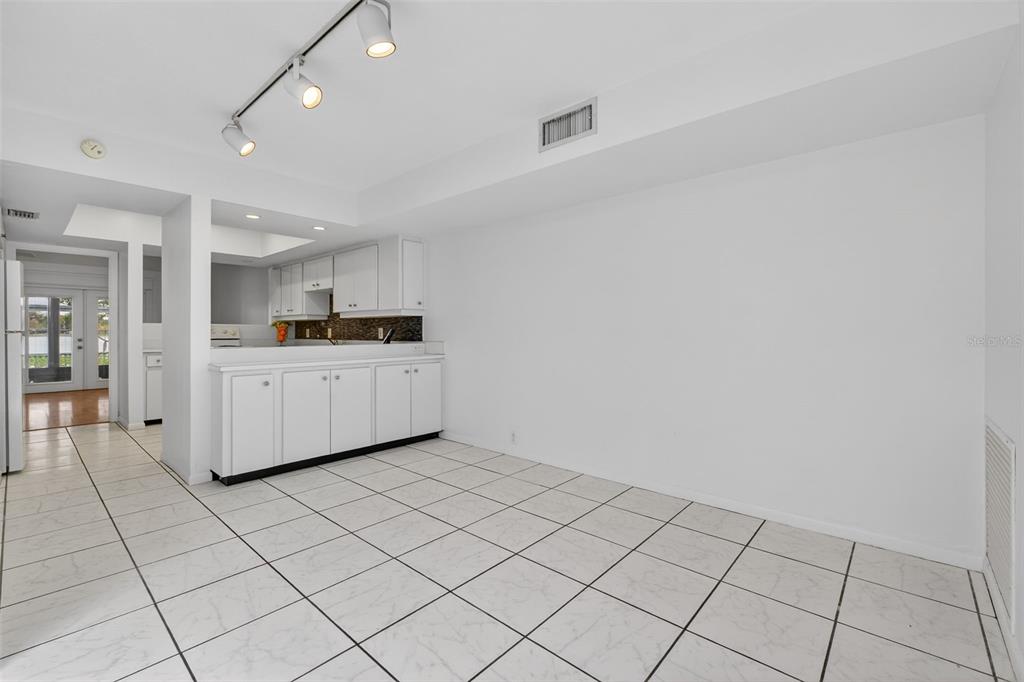 1502 Buckeye Road Northeast, Unit 4 Winter Haven, FL 33881 - Photo 16 of 49 a kitchen with white cabinets and sink