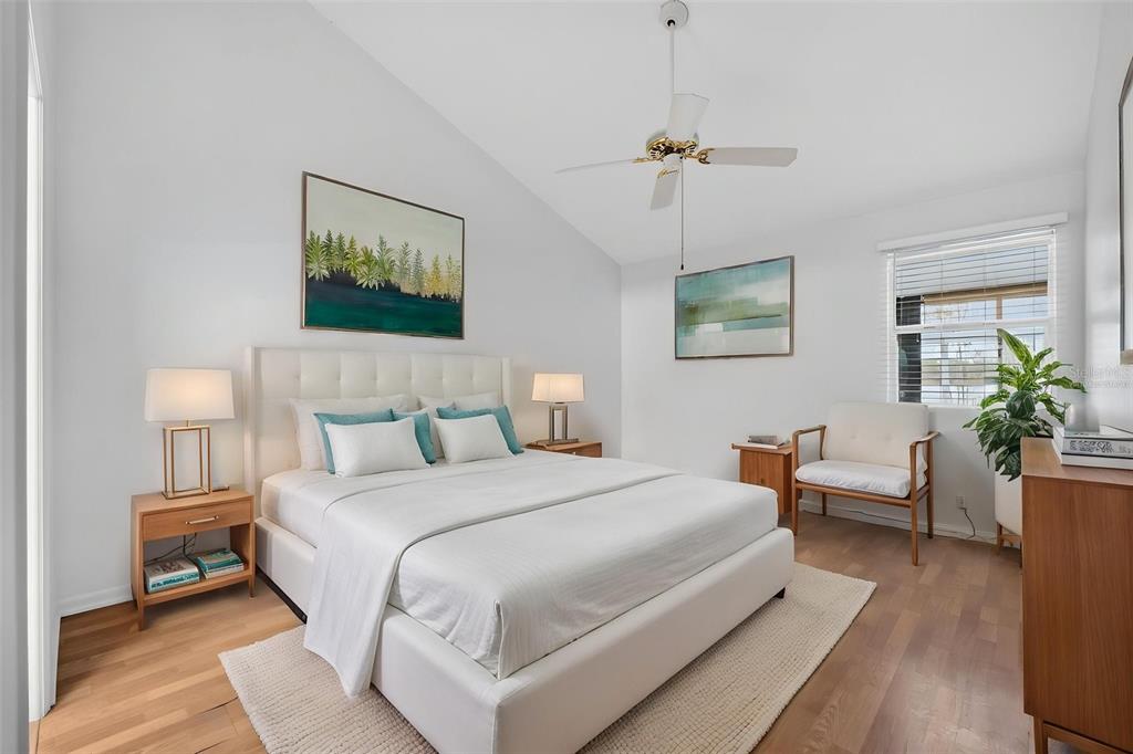 1502 Buckeye Road Northeast, Unit 4 Winter Haven, FL 33881 - Photo 19 of 49 a bedroom with bed and a potted plant