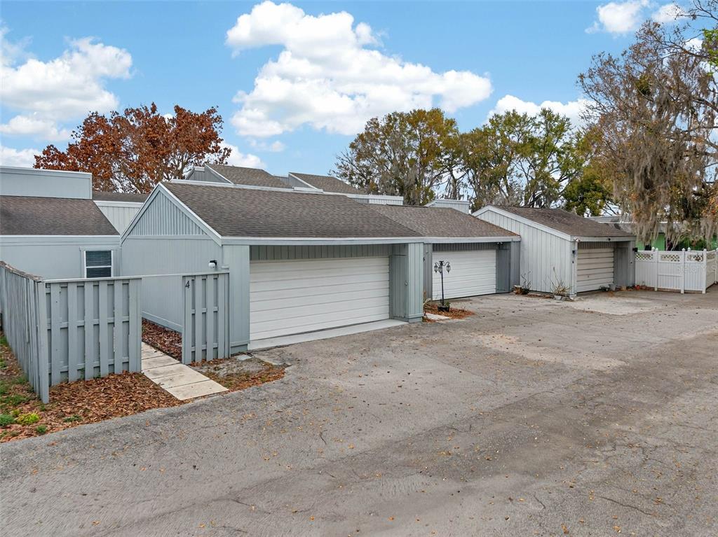 1502 Buckeye Road Northeast, Unit 4 Winter Haven, FL 33881 - Photo 2 of 49 front view of a house with a garage