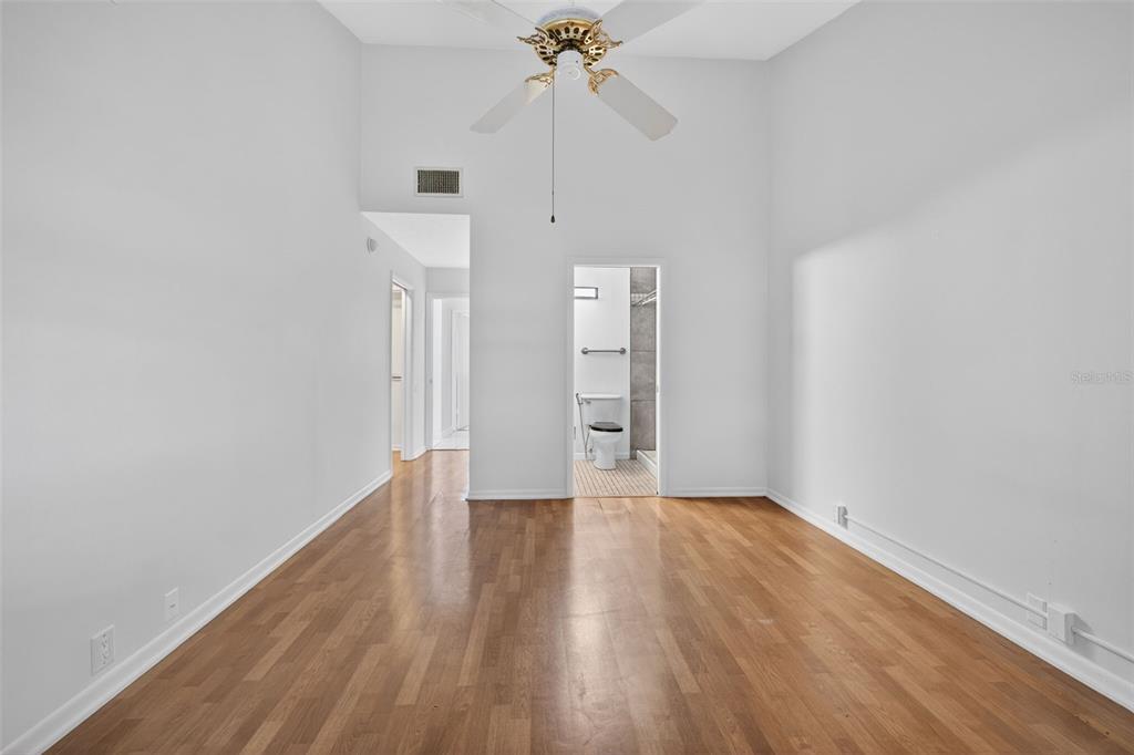 1502 Buckeye Road Northeast, Unit 4 Winter Haven, FL 33881 - Photo 21 of 49 a view of an empty room with wooden floor