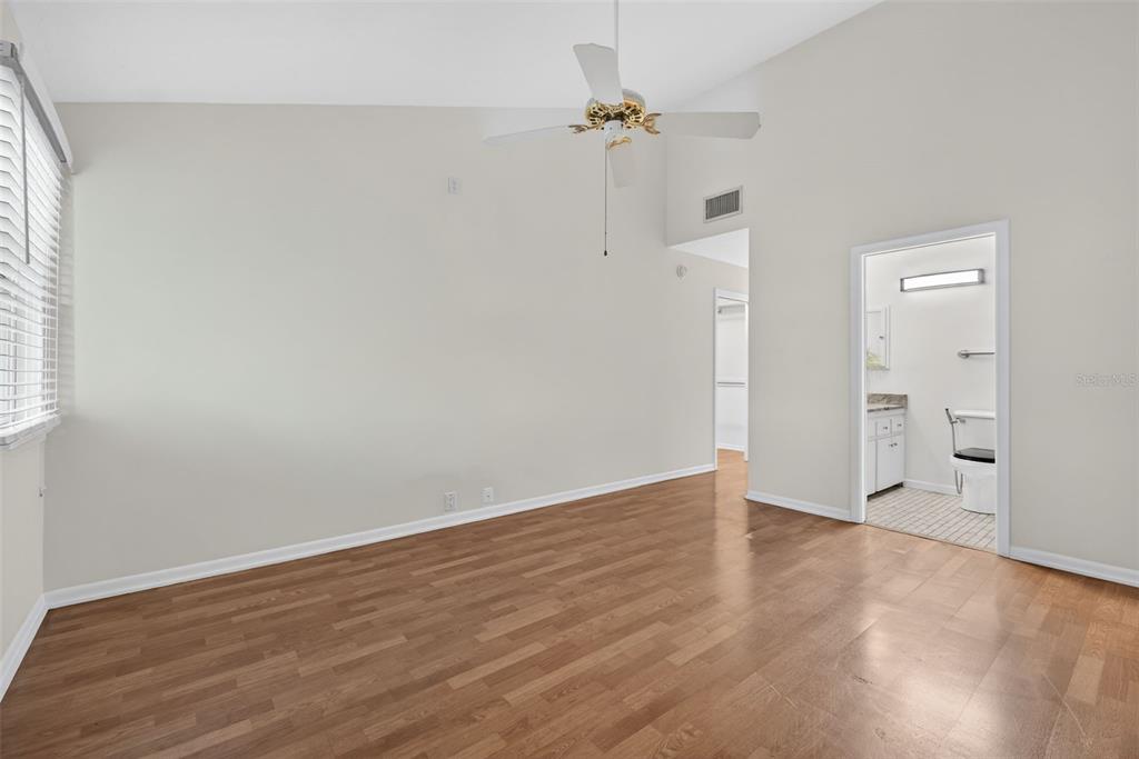 1502 Buckeye Road Northeast, Unit 4 Winter Haven, FL 33881 - Photo 22 of 49 wooden floor in an empty room