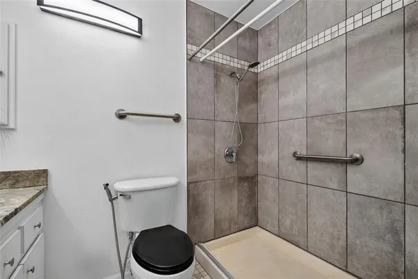 a view of room with window and ceiling fan