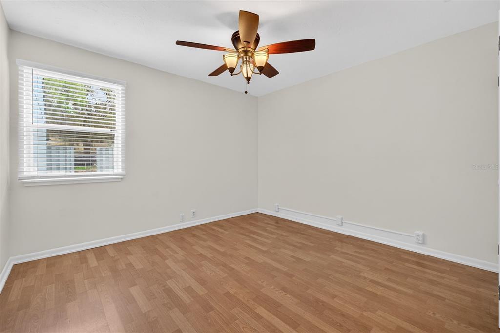 1502 Buckeye Road Northeast, Unit 4 Winter Haven, FL 33881 - Photo 28 of 49 a view of room with window and ceiling fan