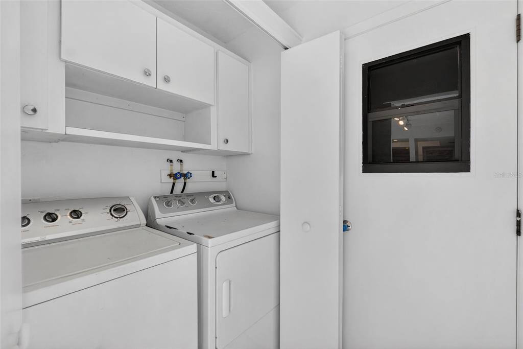 1502 Buckeye Road Northeast, Unit 4 Winter Haven, FL 33881 - Photo 32 of 49 a utility room with dryer and washer