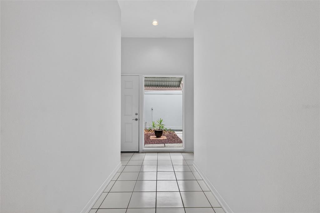 1502 Buckeye Road Northeast, Unit 4 Winter Haven, FL 33881 - Photo 33 of 49 a hallway with a outdoor space