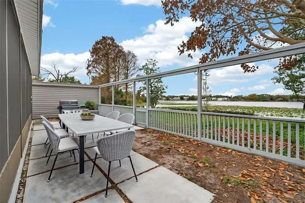 an aerial view of a house with outdoor space and lake view