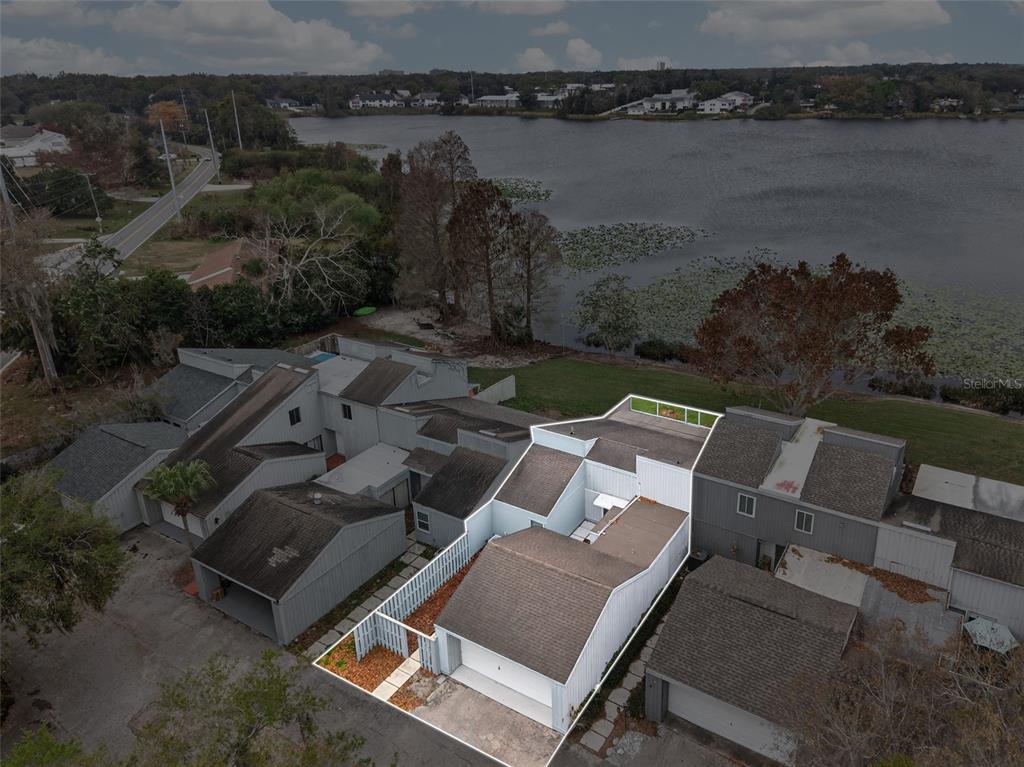 1502 Buckeye Road Northeast, Unit 4 Winter Haven, FL 33881 - Photo 43 of 49 an aerial view of house with lake