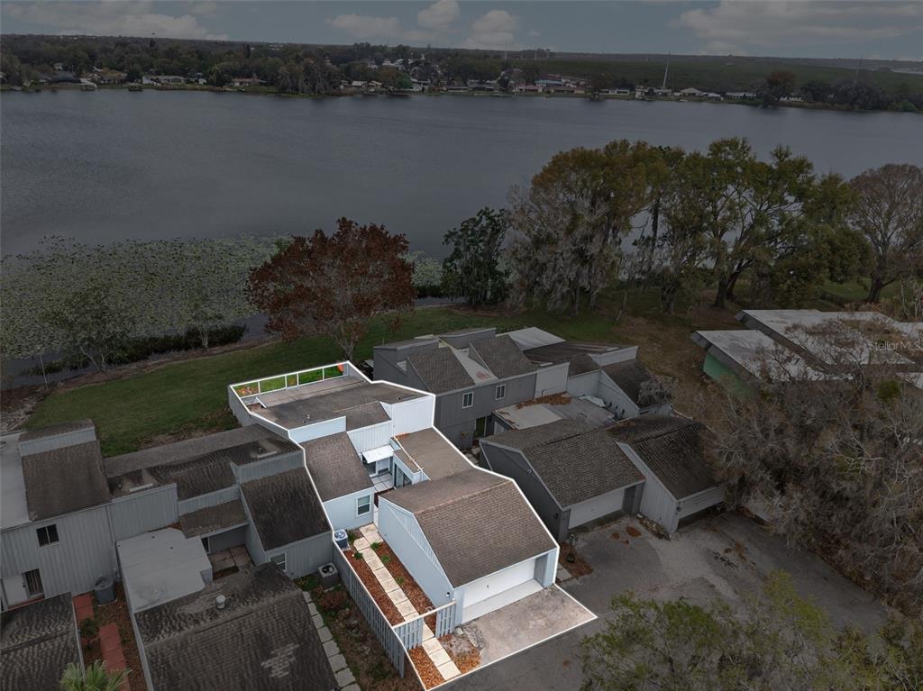 1502 Buckeye Road Northeast, Unit 4 Winter Haven, FL 33881 - Photo 45 of 49 an aerial view of a house with lake view