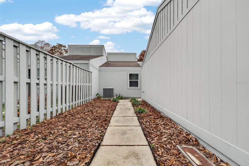 1502 Buckeye Road Northeast, Unit 4 Winter Haven, FL 33881 - Photo 48 of 49 a view of a pathway front of the house