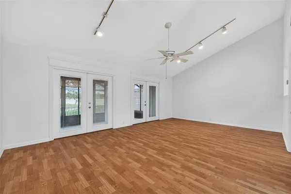 a view of an empty room with a large window