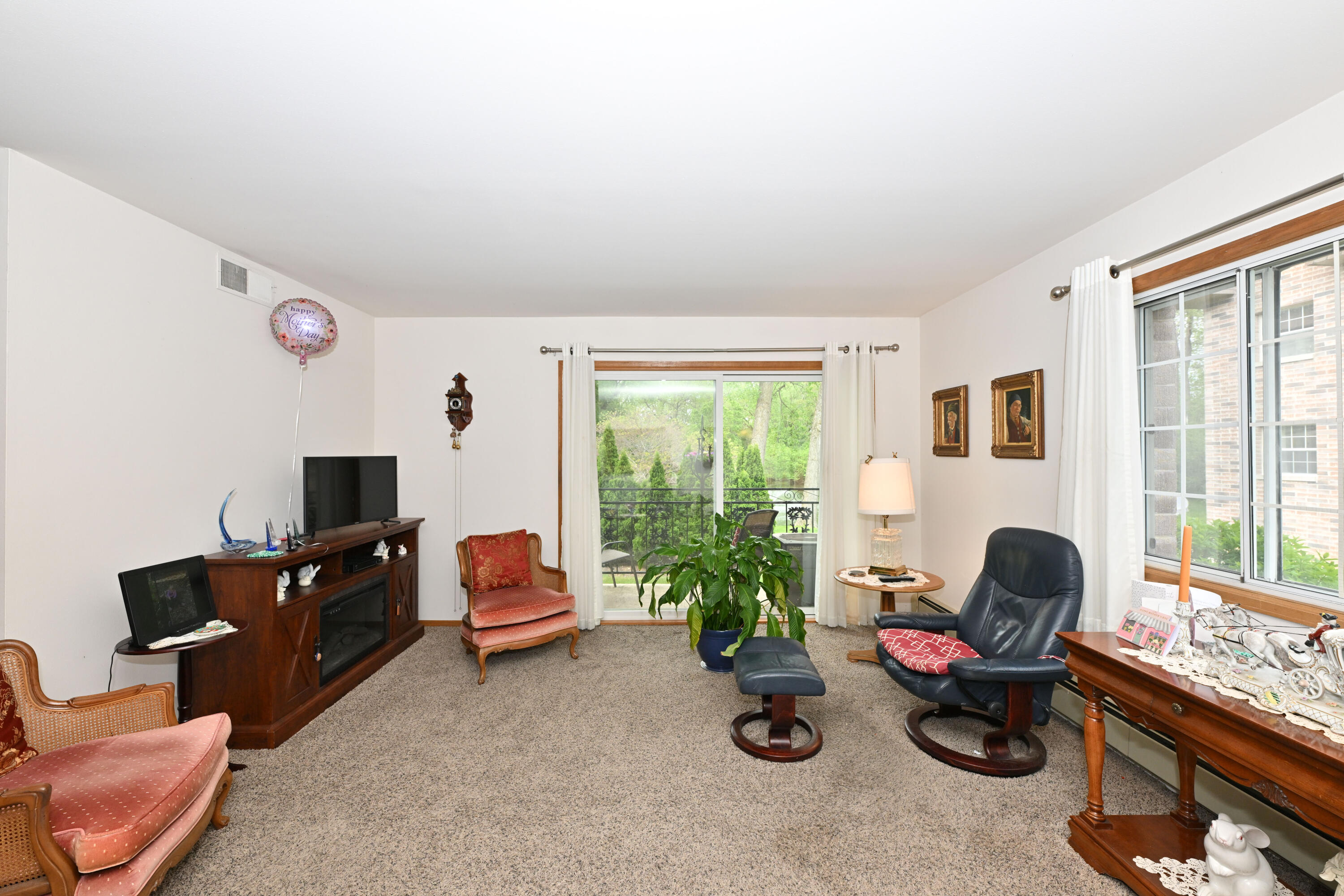 1730 West Green Tree Road, Unit 104 Glendale, WI 53209 - Photo 9 of 28 sliding doors to balcony overlooking pond!