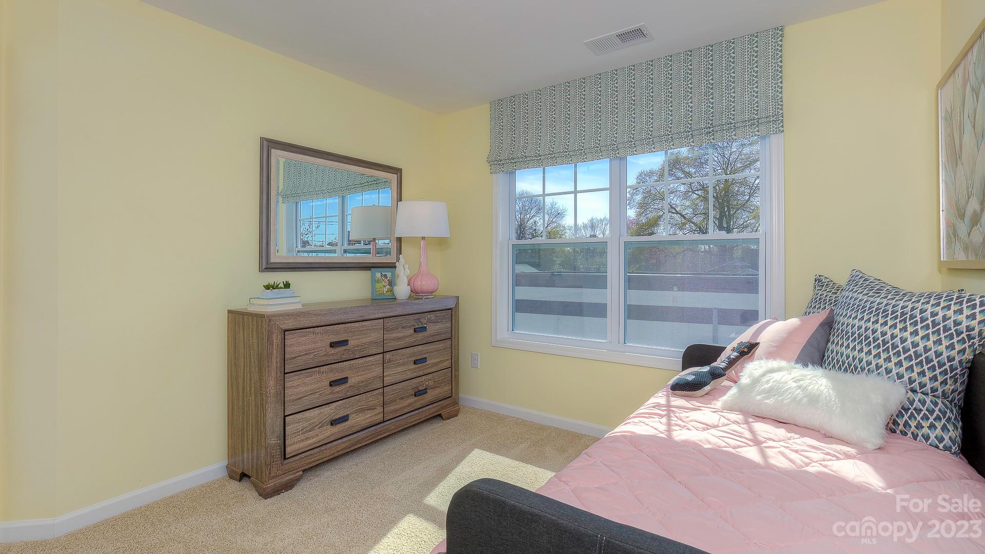38 Ravens Rdg Road Hendersonville, NC 28792 - Photo 30 of 36 a bedroom with a bed and a dresser