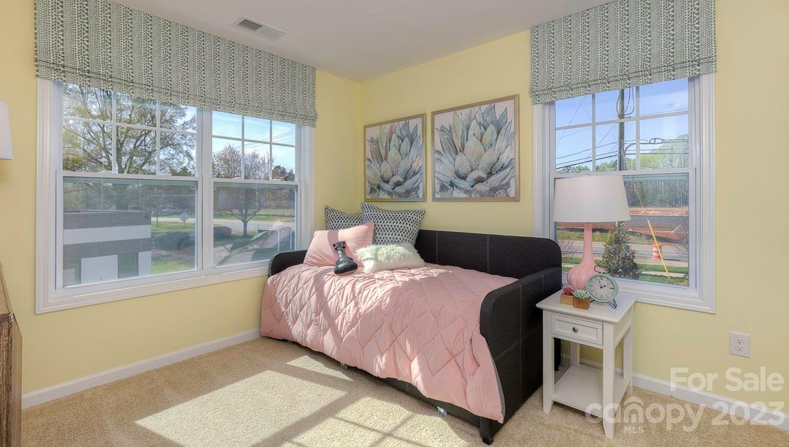 38 Ravens Rdg Road Hendersonville, NC 28792 - Photo 32 of 36 a bedroom with a bed and a painting on the wall