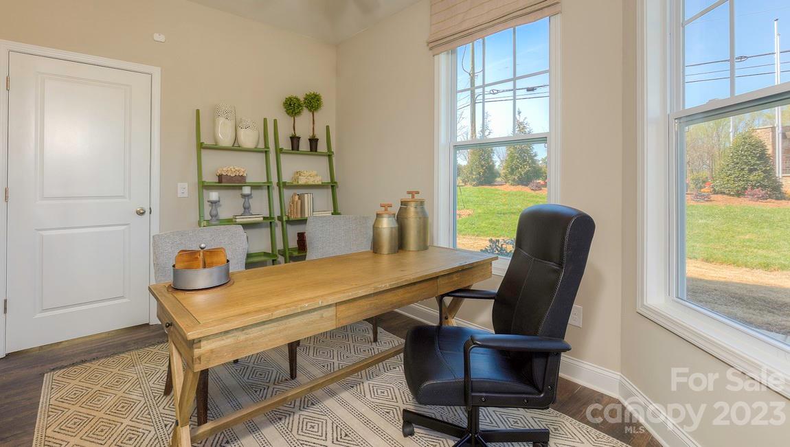 38 Ravens Rdg Road Hendersonville, NC 28792 - Photo 6 of 36 a view of a workspace with furniture and a window