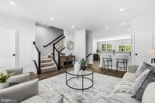 a living room with furniture and white walls