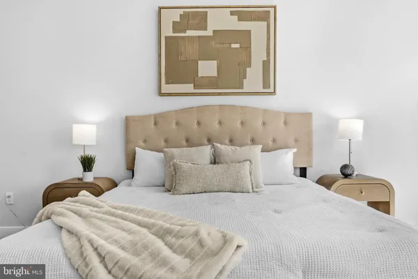 a bedroom with a bed and window