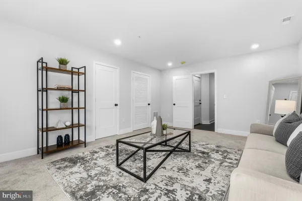 a living room with furniture and a table