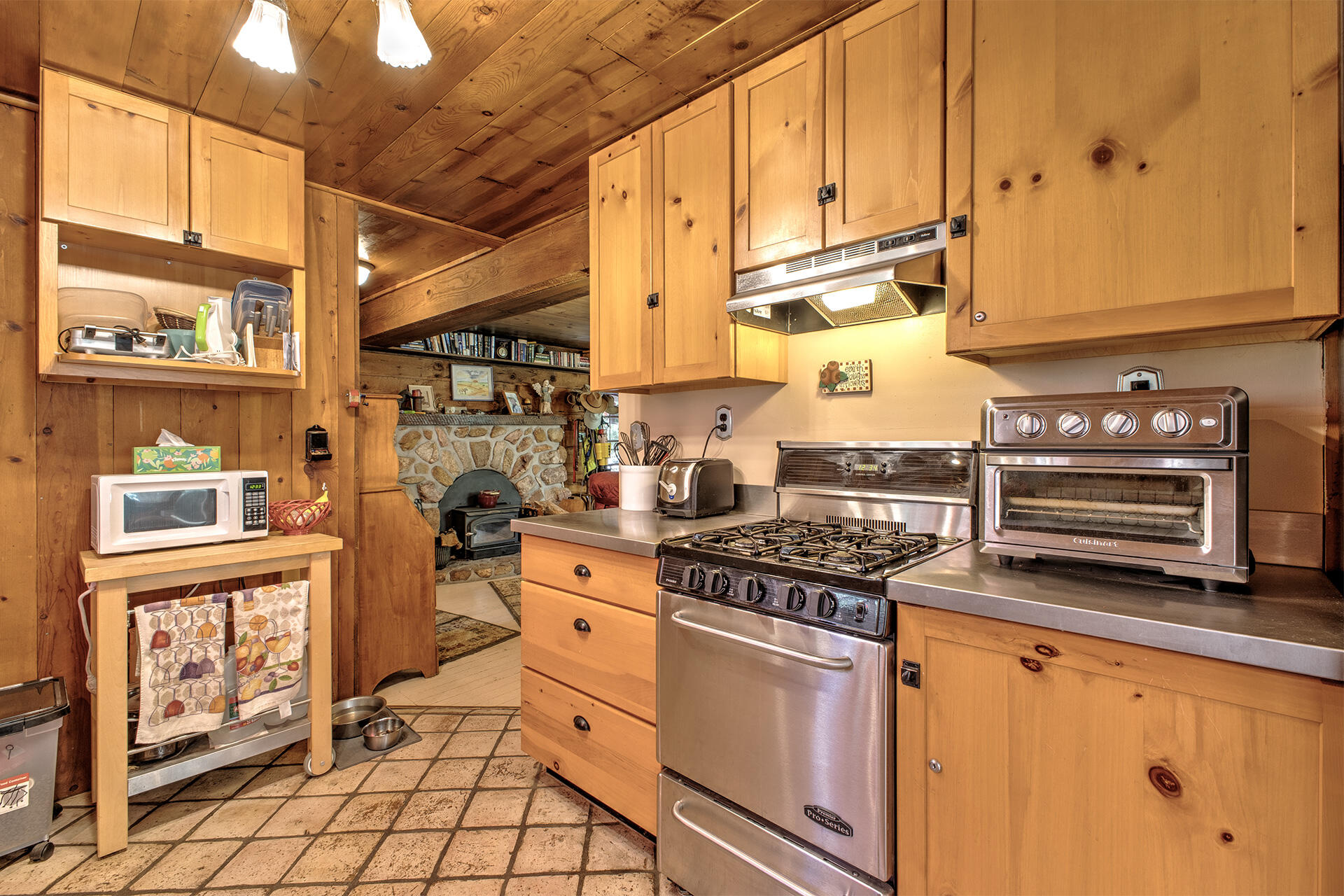 25395 Lodge Road Idyllwild, CA 92549 - Photo 11 of 53 a kitchen with stainless steel appliances granite countertop a stove a sink and a cabinets