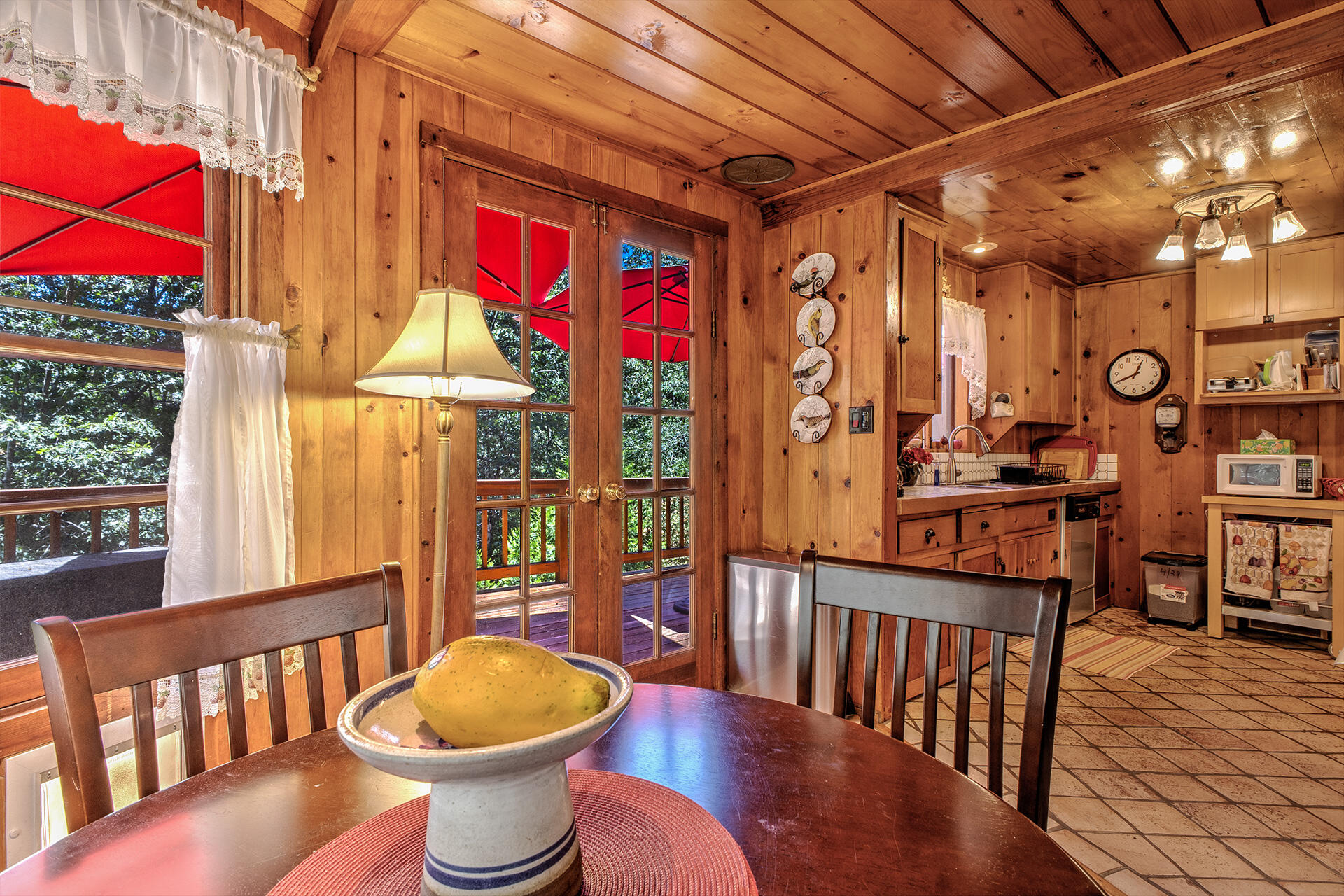 25395 Lodge Road Idyllwild, CA 92549 - Photo 15 of 53 a view of a balcony with chairs and wooden floor