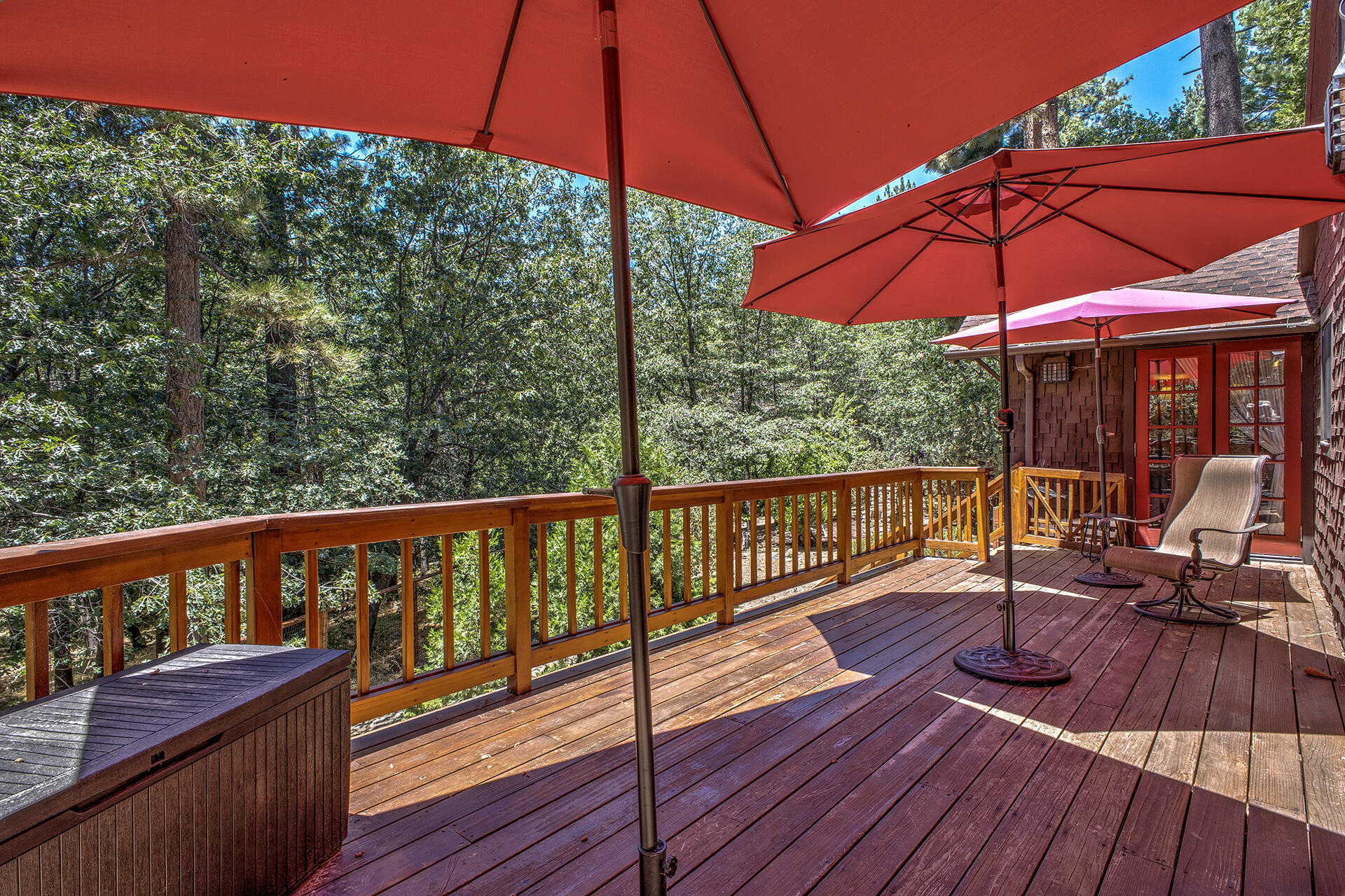 25395 Lodge Road Idyllwild, CA 92549 - Photo 19 of 53 a view of a deck with wooden floor and umbrella