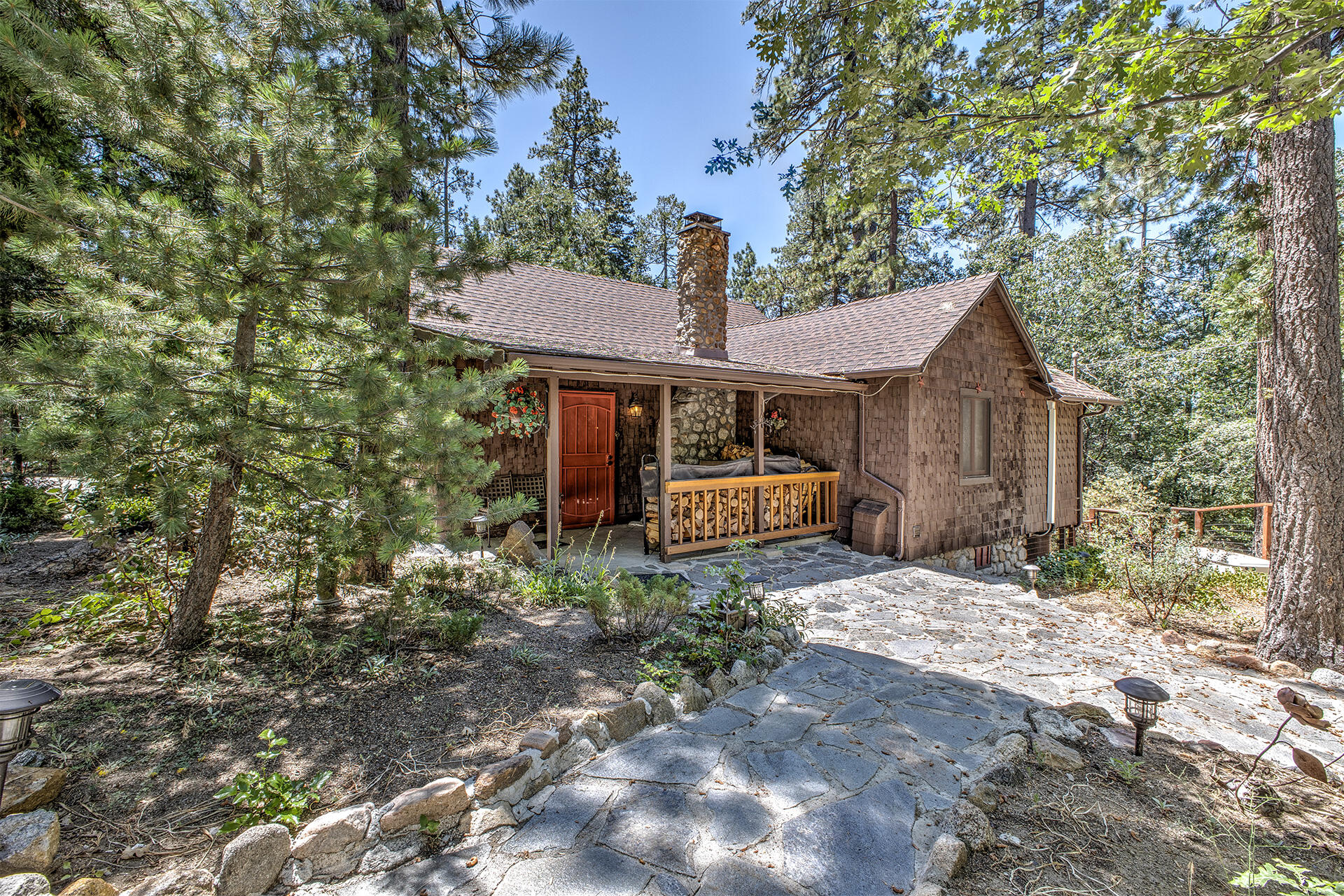 25395 Lodge Road Idyllwild, CA 92549 - Photo 2 of 53 a front view of a house with garden