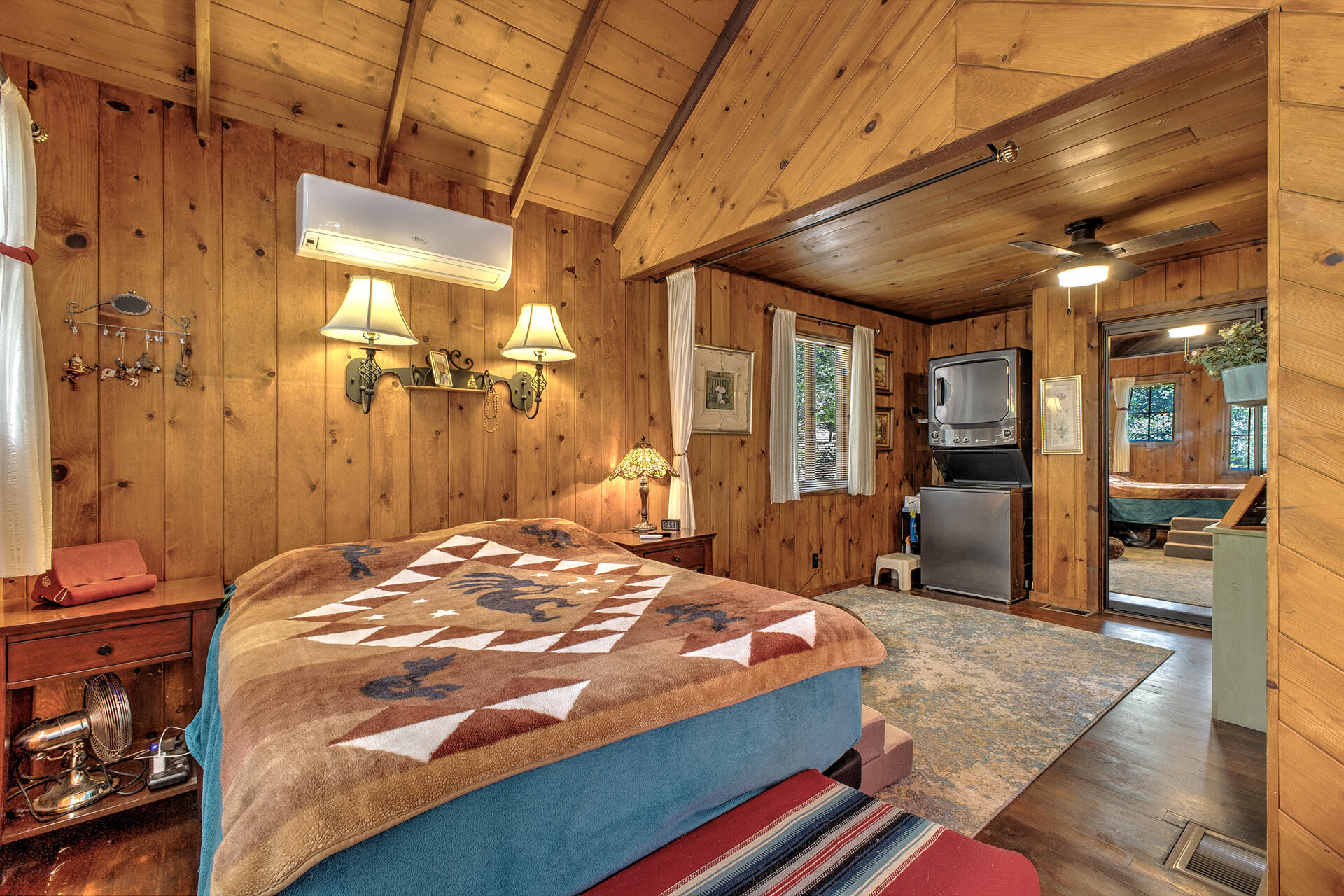 25395 Lodge Road Idyllwild, CA 92549 - Photo 26 of 53 a bedroom with a bed and wooden floor